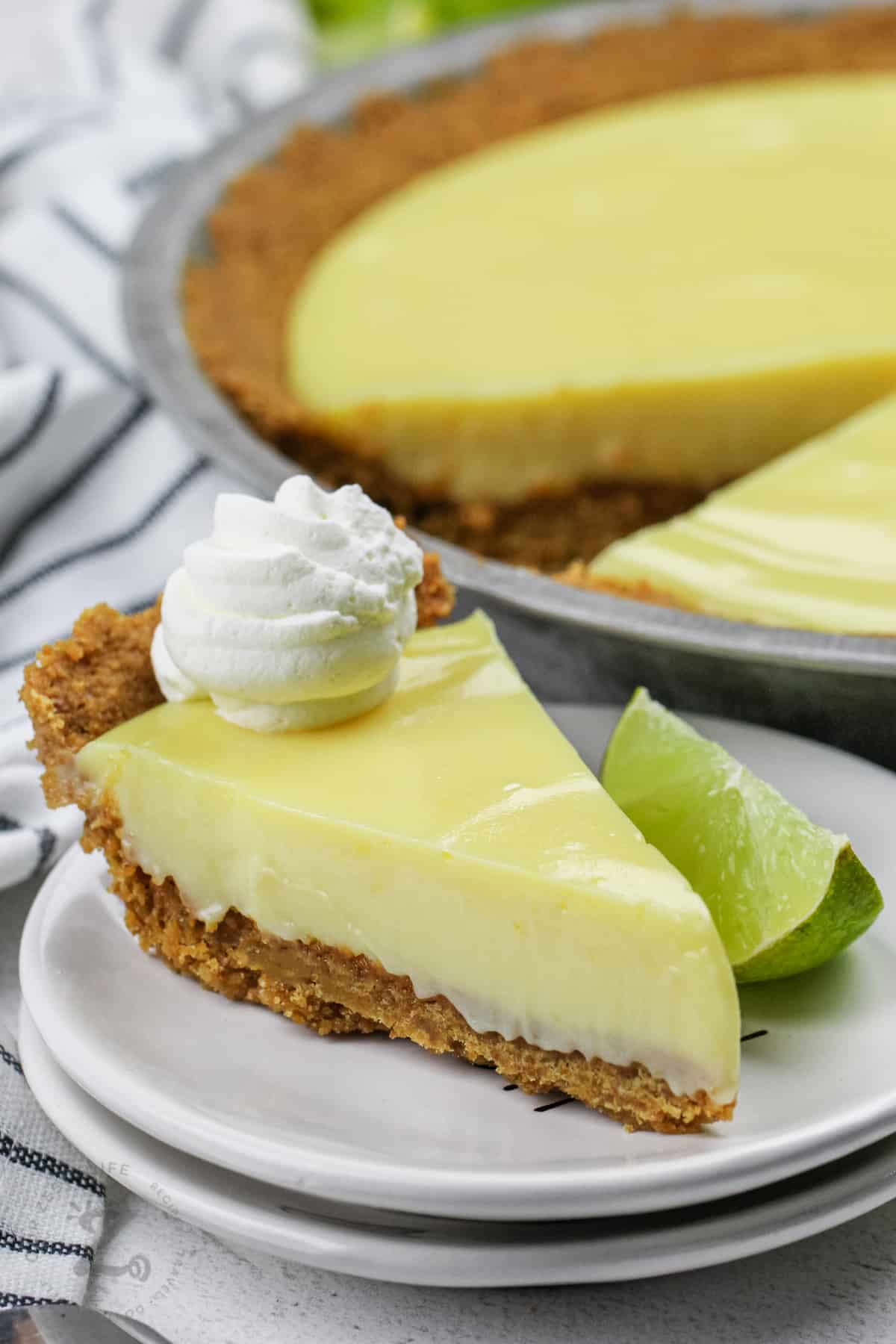 slice of Key Lime Pie with a lime wedge