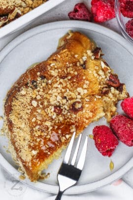 close up of Overnight Panettone French Toast slice with raspberries