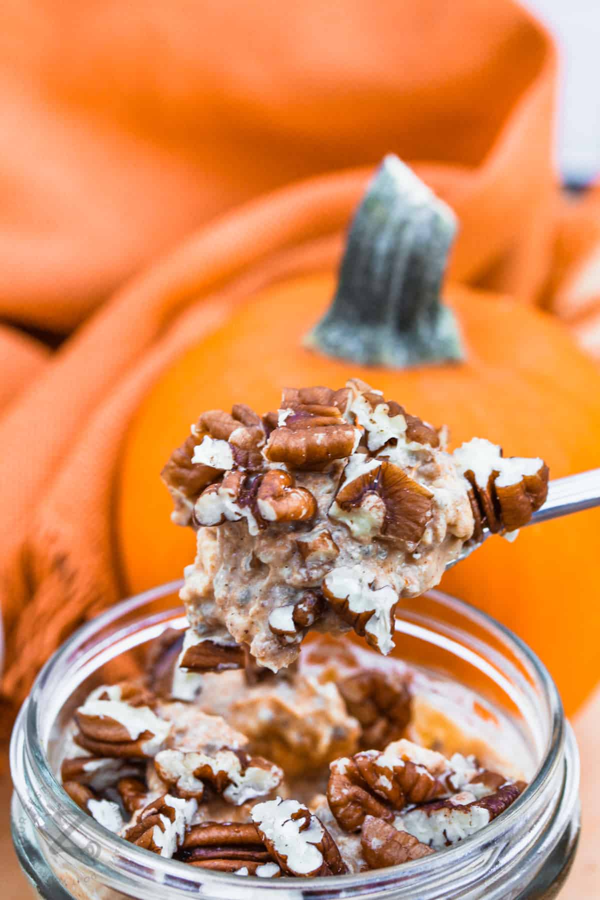 taking a spoonfull of Pumpkin Overnight Oats out of the jar