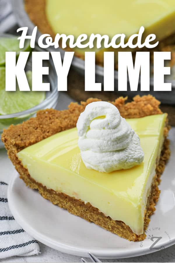 Key Lime Pie slice on a plate with writing