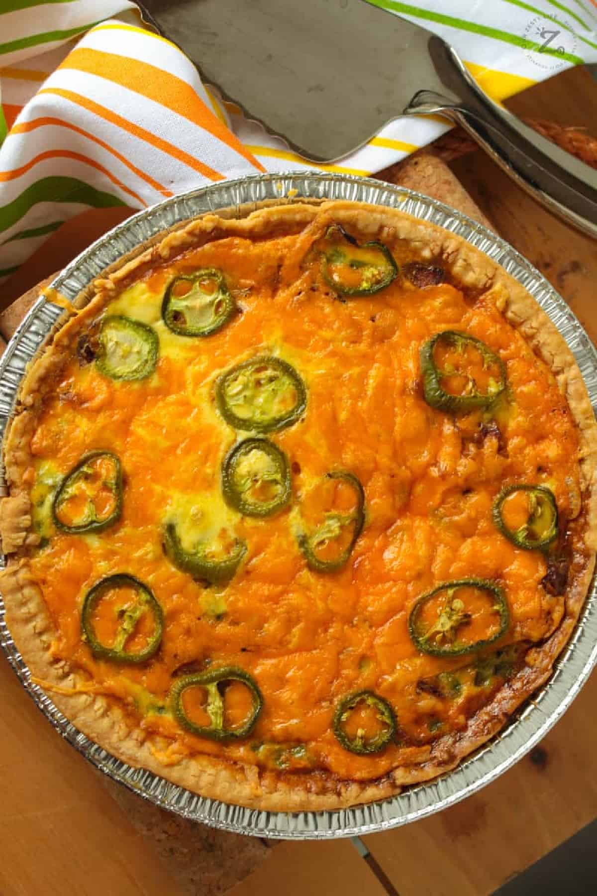 bacon and cheese quiche baked in a pie plate
