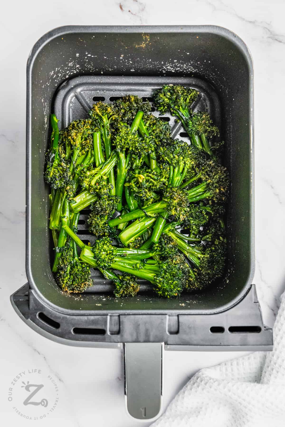cooked Air Fryer Broccolini in the fryer