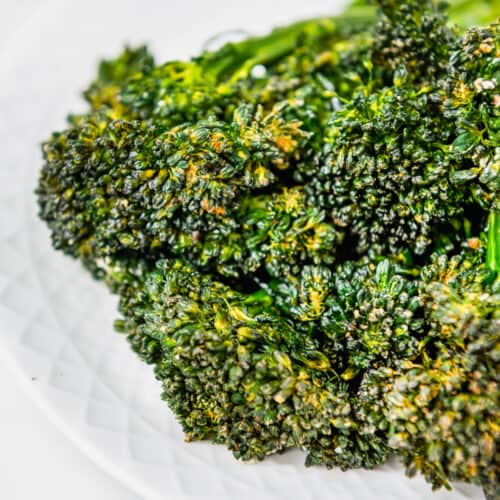 close up of cooked Air Fryer Broccolini on a plate
