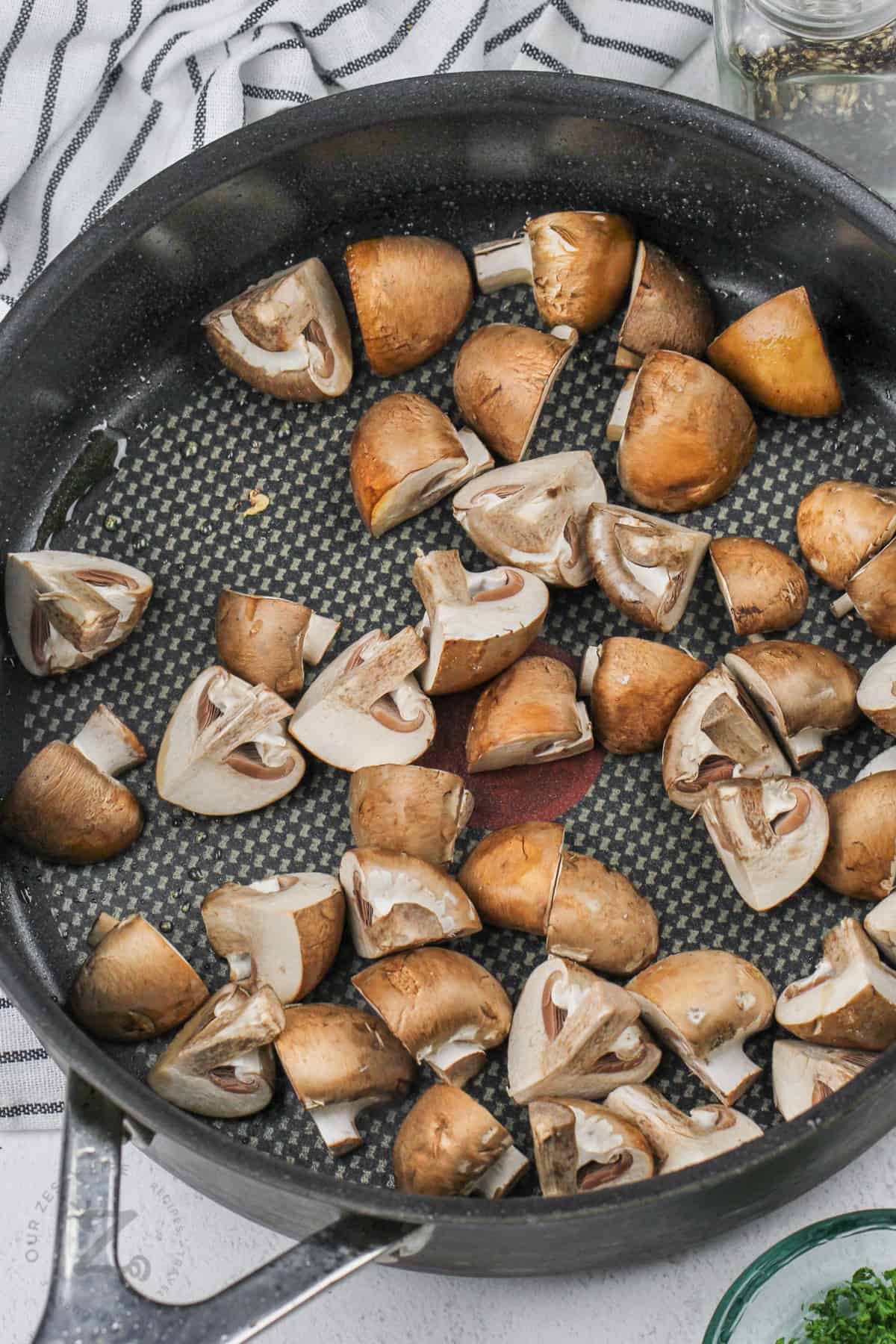adding mushrooms to the pan to make Boursin Cheese Pasta