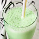 copycat shamrock shake in a clear glass with a straw