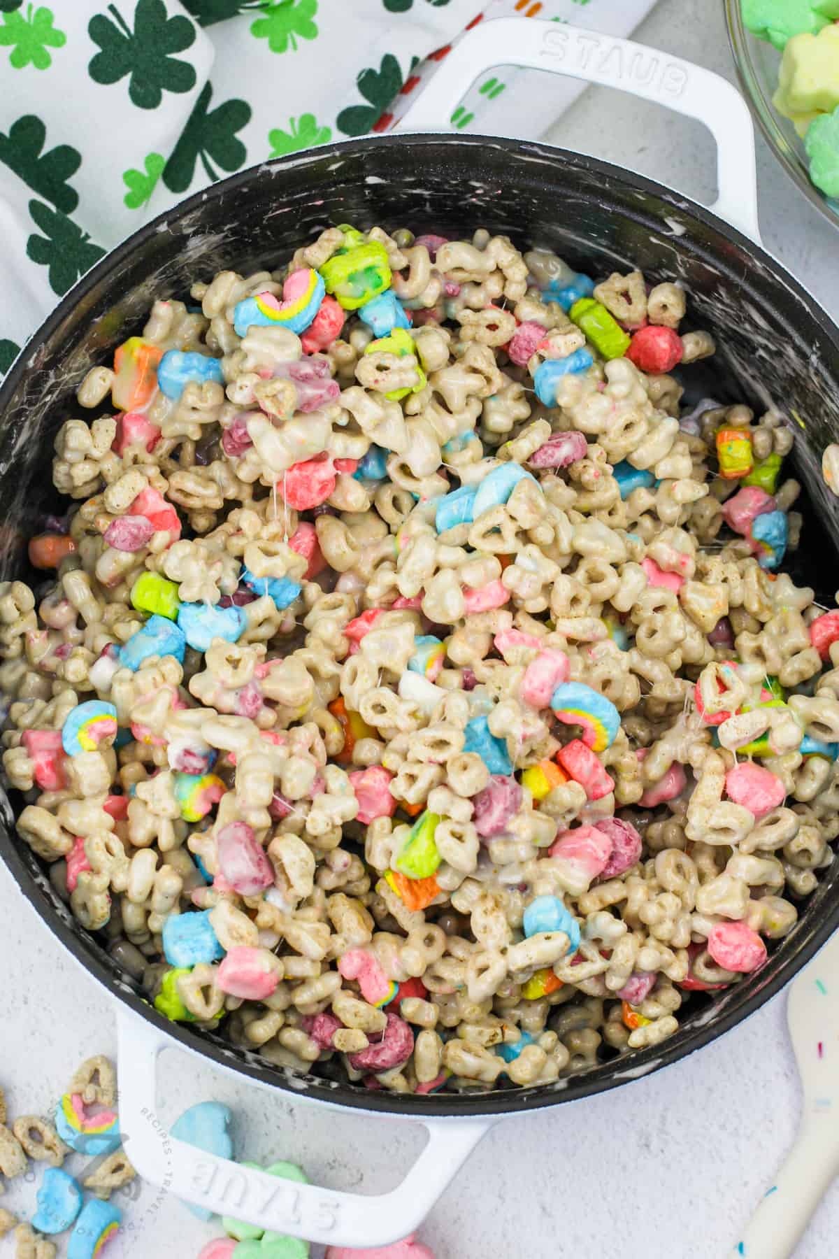 Lucky Charms Marshmallow Treats Squares ingredients mixed in the pot