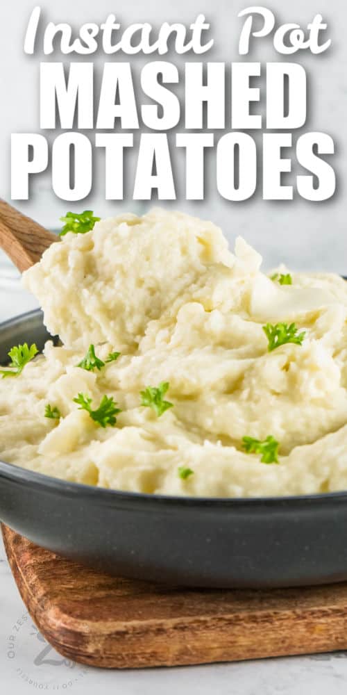 taking a spoonful of Instant Pot Mashed Potatoes with writing