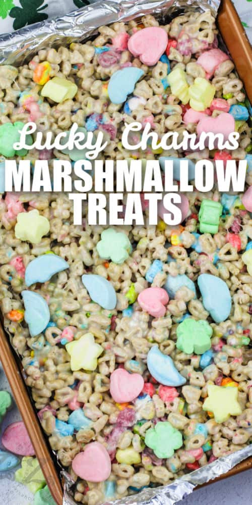 Lucky Charms Marshmallow Treats Squares in the pan with a title