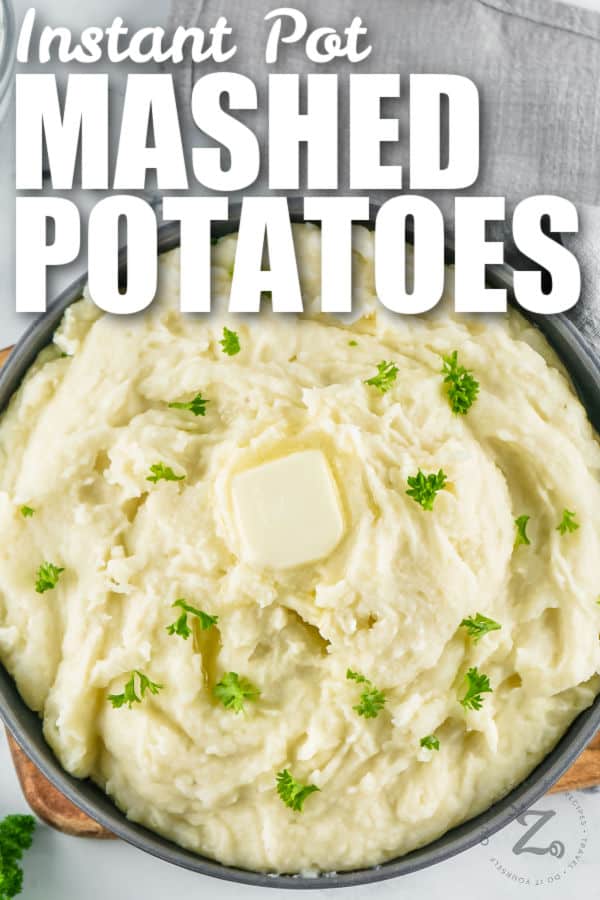 close up of Instant Pot Mashed Potatoes with butter and a title