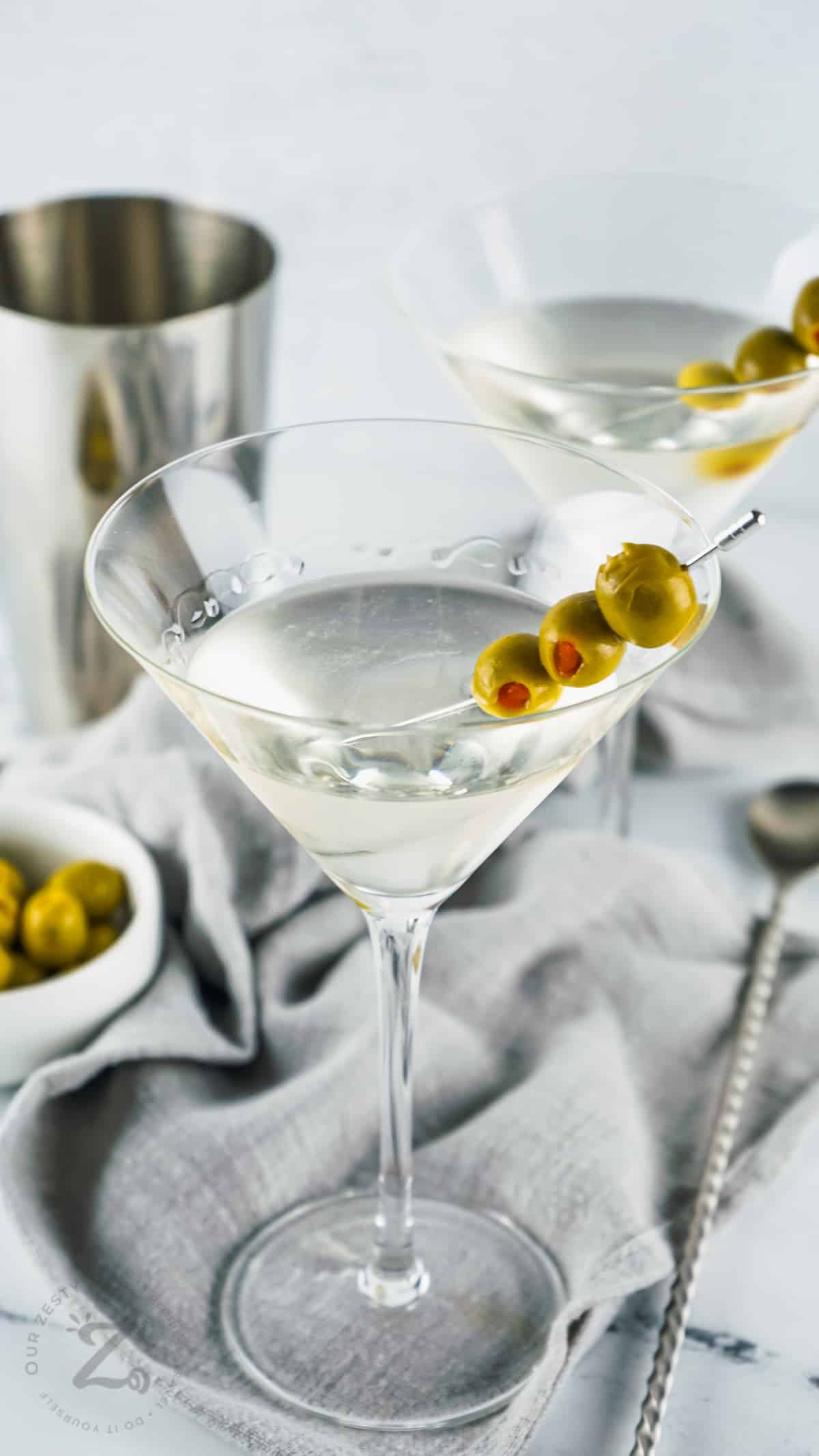 glasses of Traditional Gin Martinis with olives