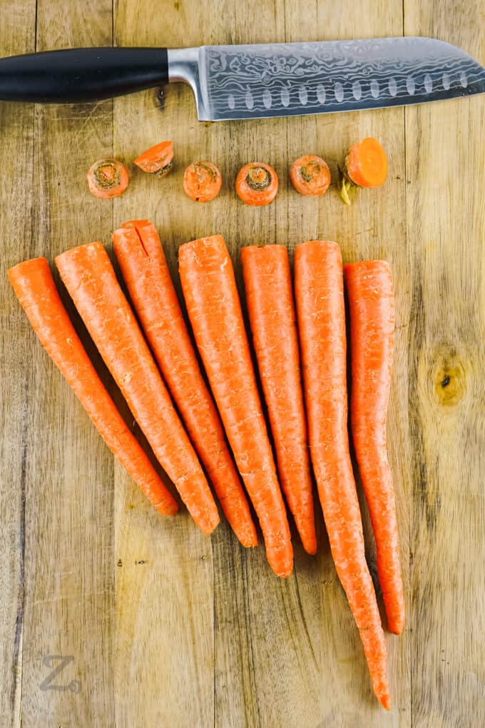 cutting off ends of carrots to make Air Fryer Carrots