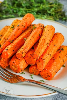 Air Fryer Carrots cooked on a plate with a fork