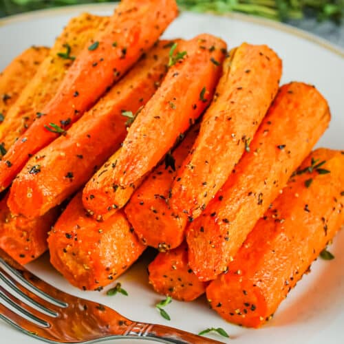 Air Fryer Carrots cooked on a plate with a fork