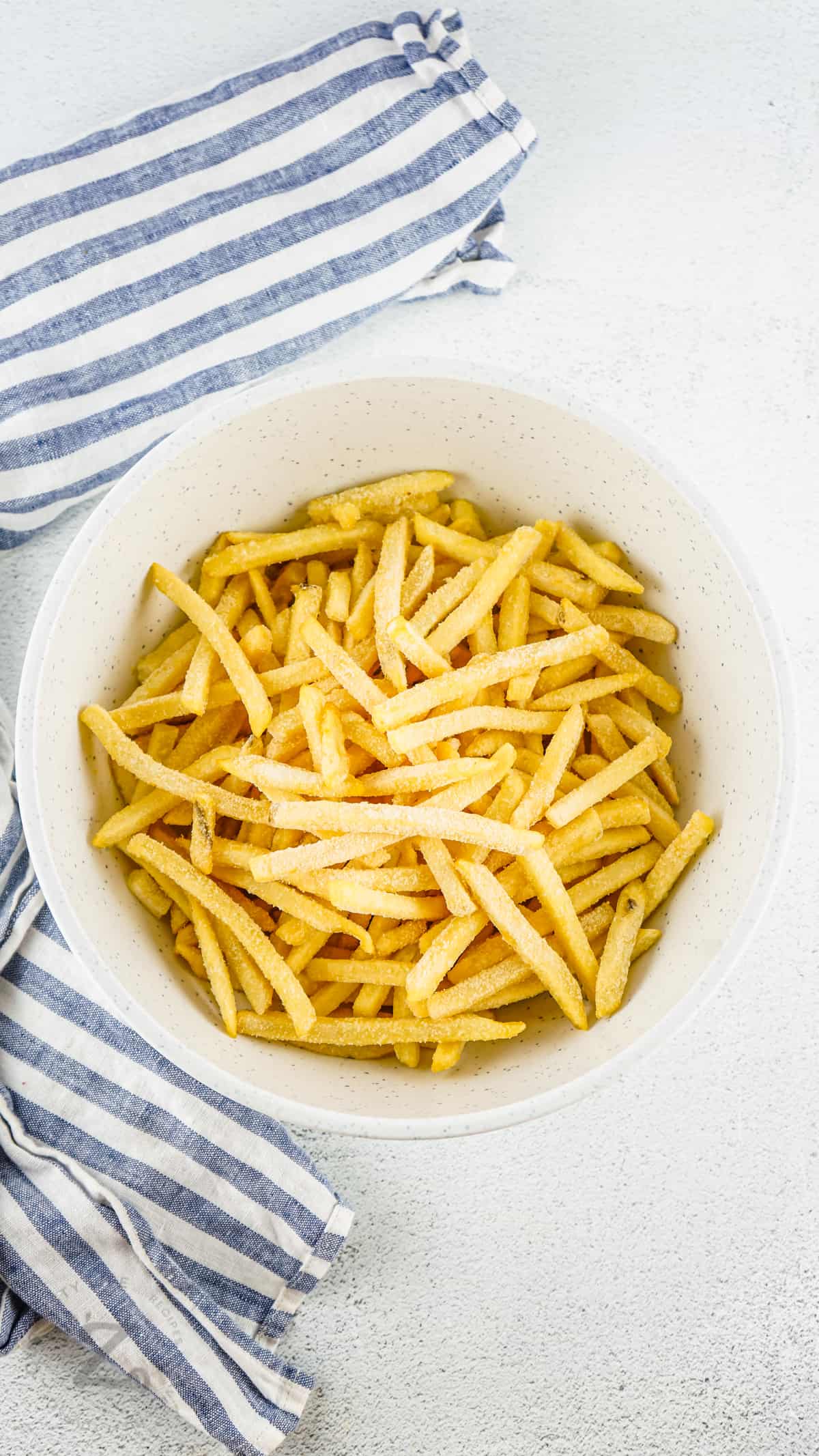 Air Fryer Frozen French Fries in a bowl before cooking