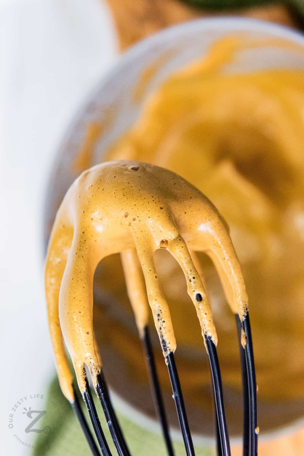 close up of Dalgona Coffee on a whisk