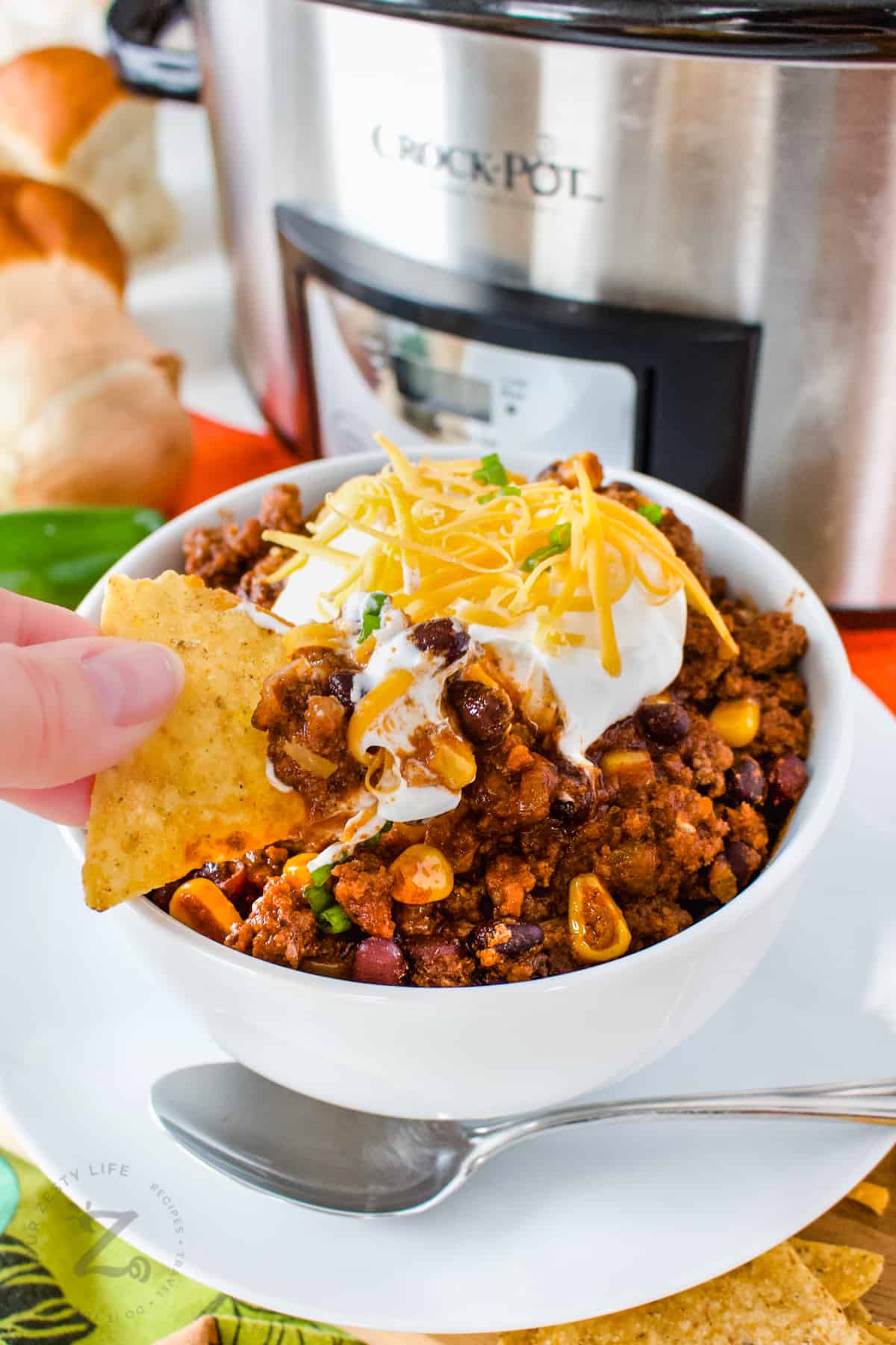 dipping a chip in Easy Crockpot Black Bean Chili