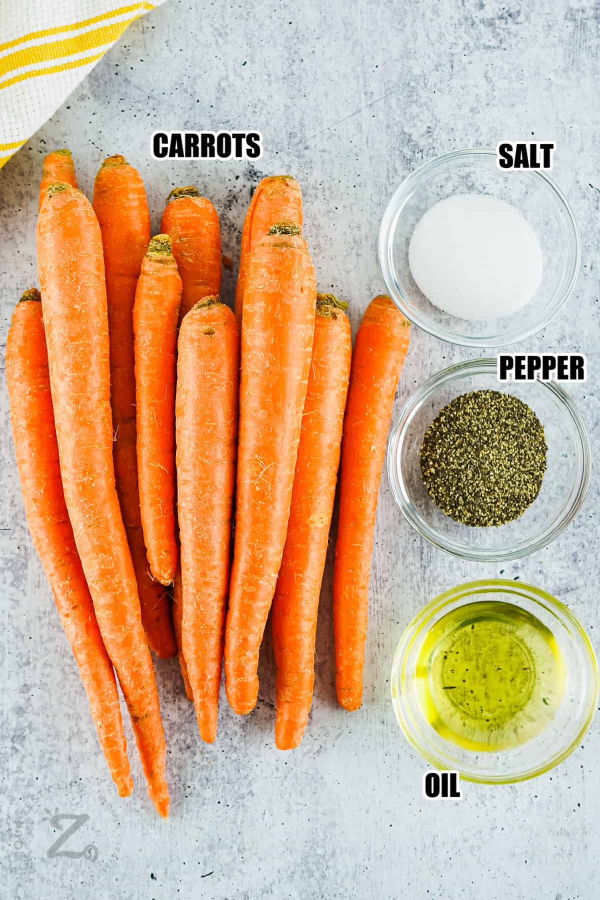 carrots , salt , pepper and oil with labels to make Air Fryer Carrots