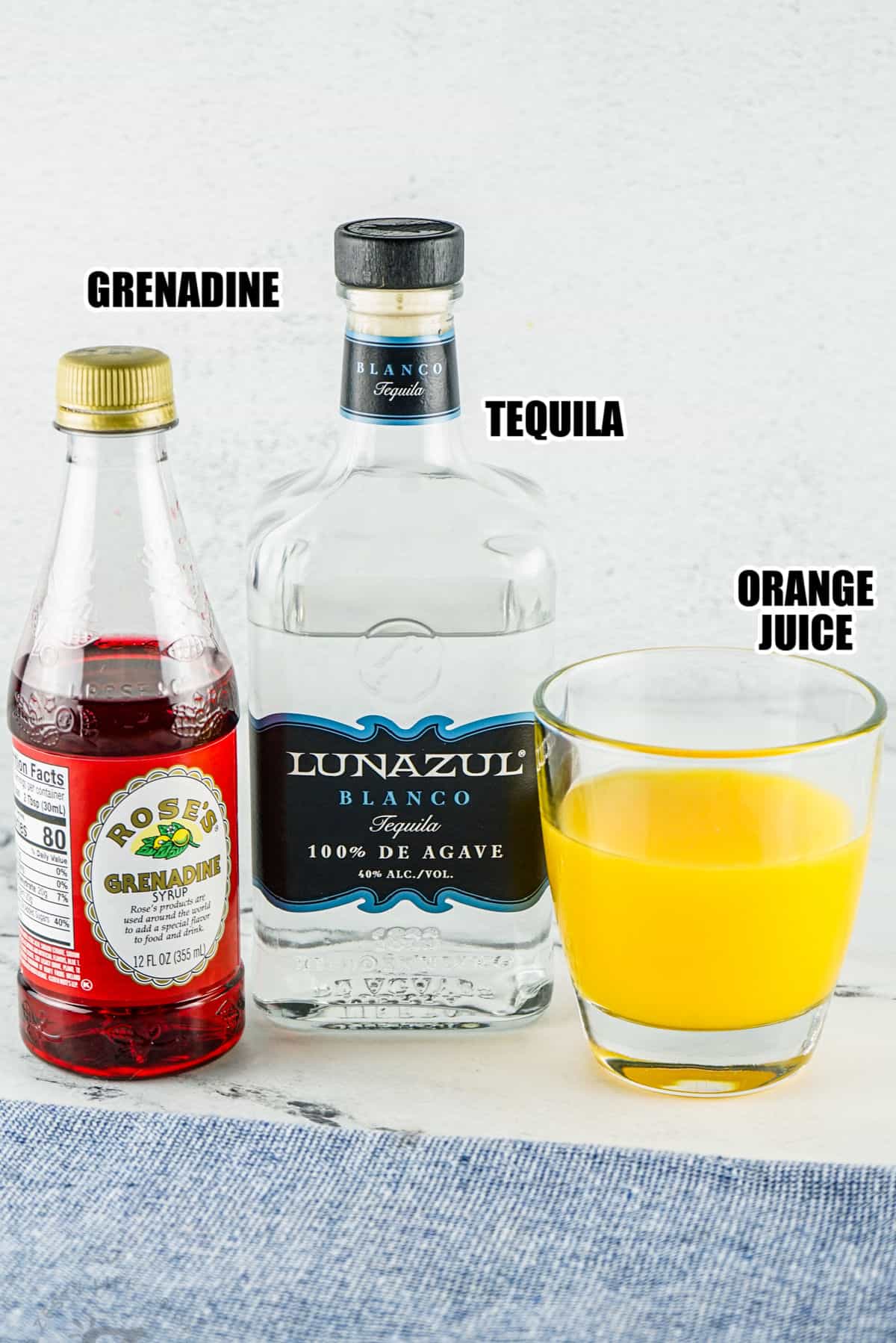 grenadine , tequila and orange juice with labels to make Tequila Sunrise