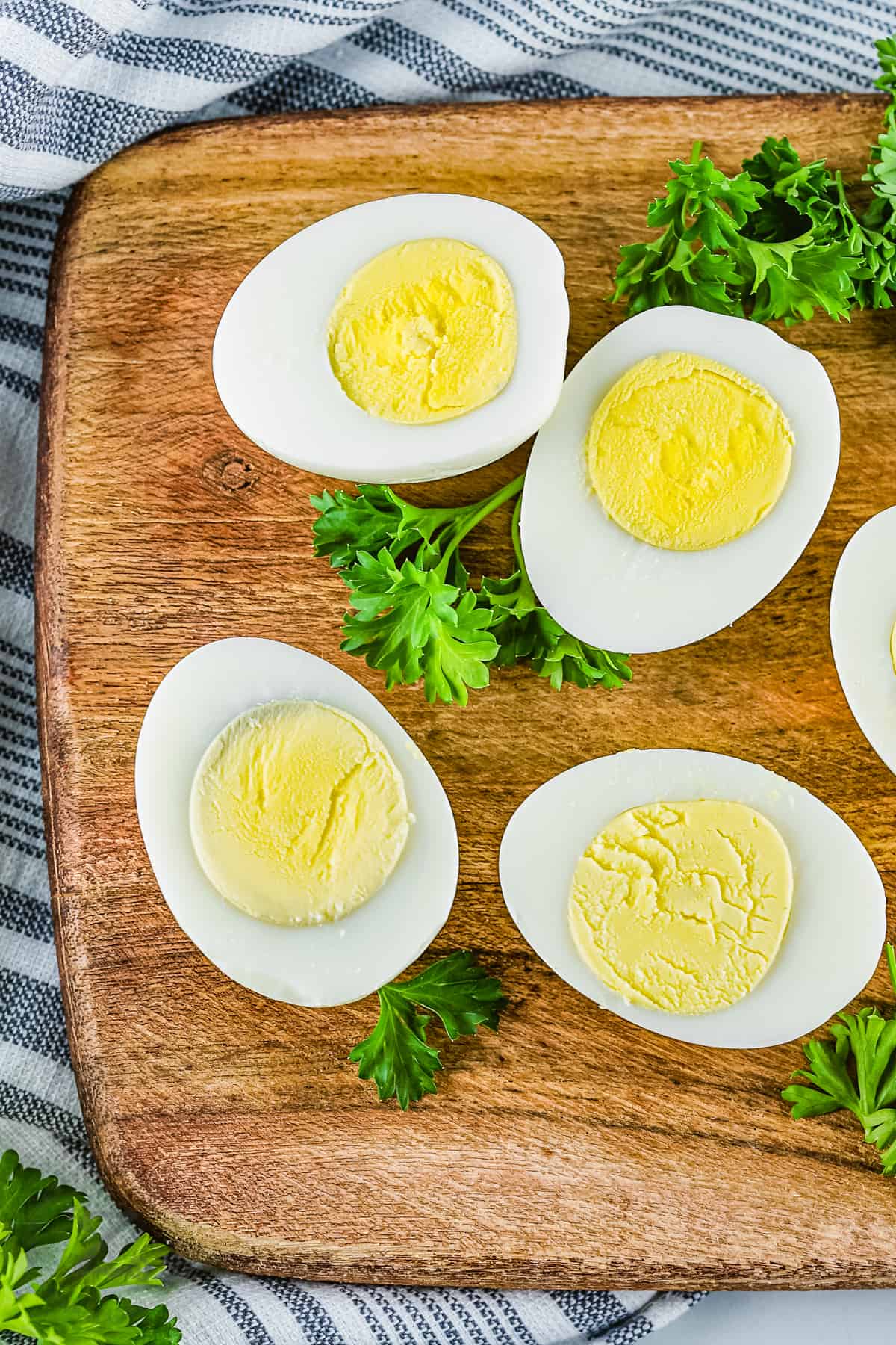 top view of sliced Instant Pot Eggs on a cutting board