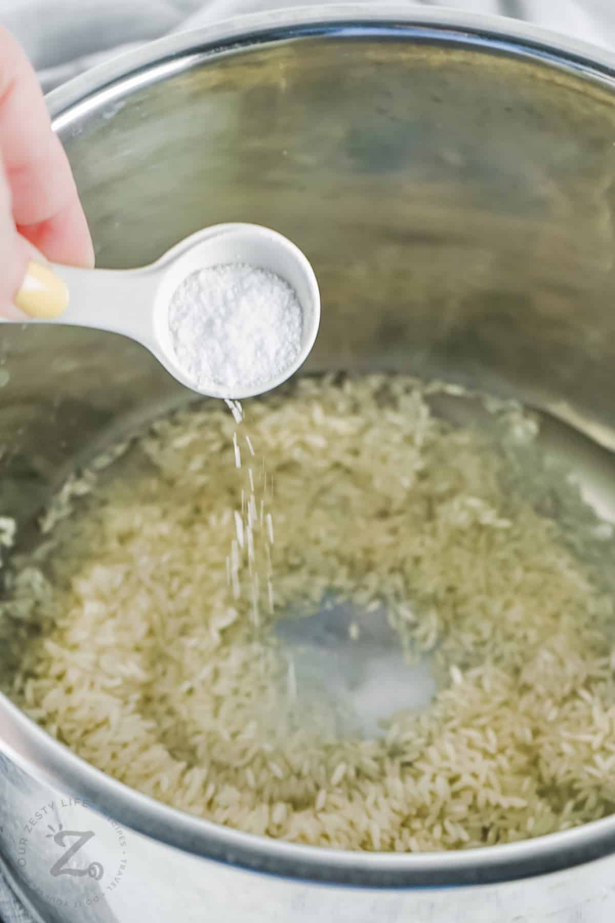adding salt to rice to make Instant Pot Rice