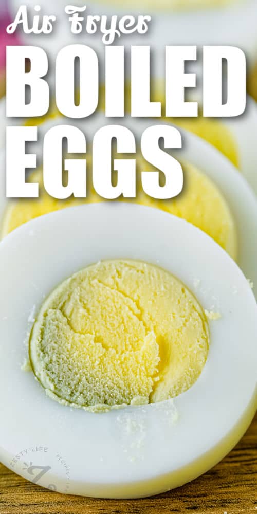 close up of Air Fryer Boiled Eggs cut into slices with writing