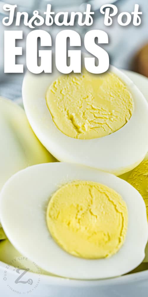 close up of Instant Pot Eggs sliced in half with a title