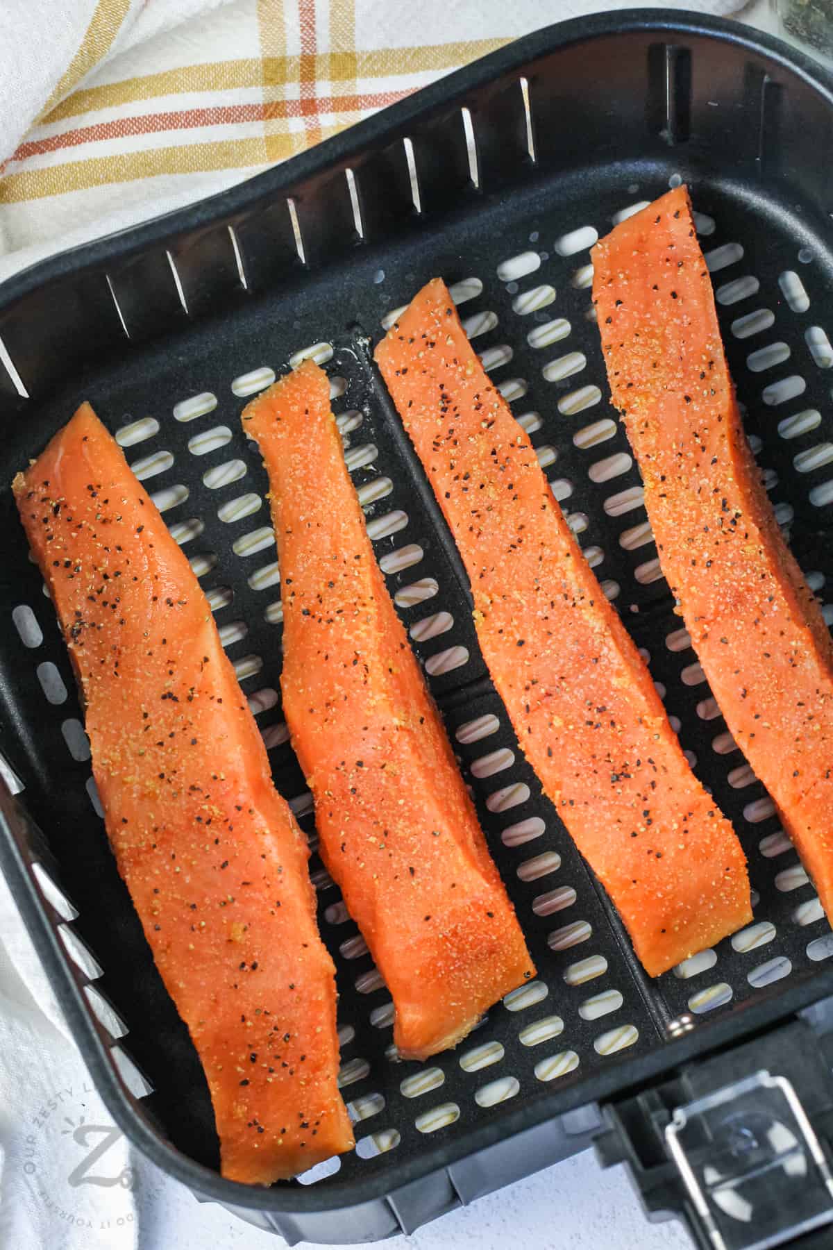 seasoned salmon in the air fryer to make Air Fryer Salmon