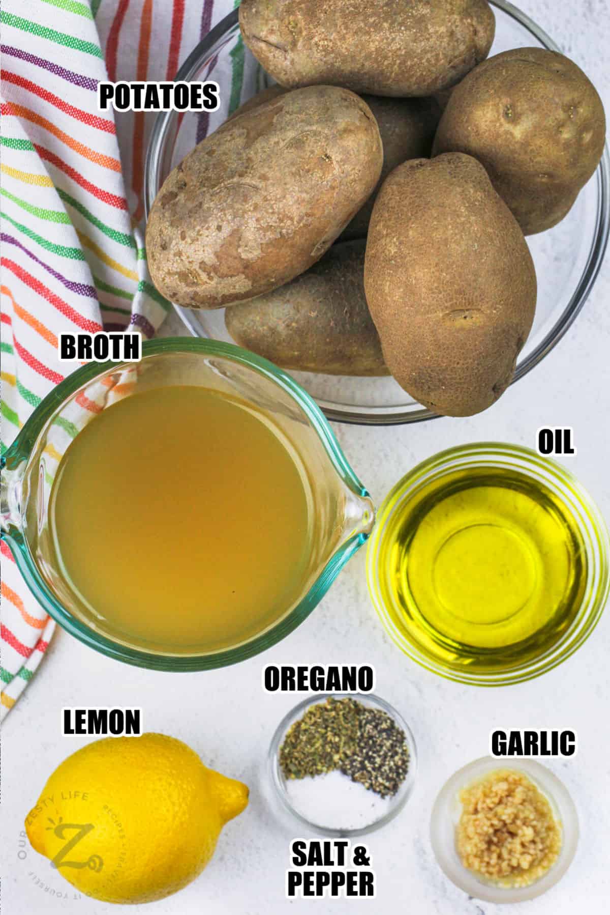 potatoes , broth , oil , garlic , oregano, lemon and salt and pepper with labels to make Greek Style Lemon Potatoes