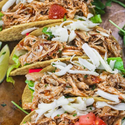 adding cheese to Instant Pot Shredded Chicken Tacos