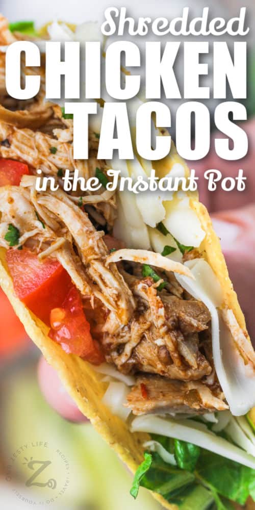 Instant Pot Shredded Chicken Tacos with tomatoes and writing