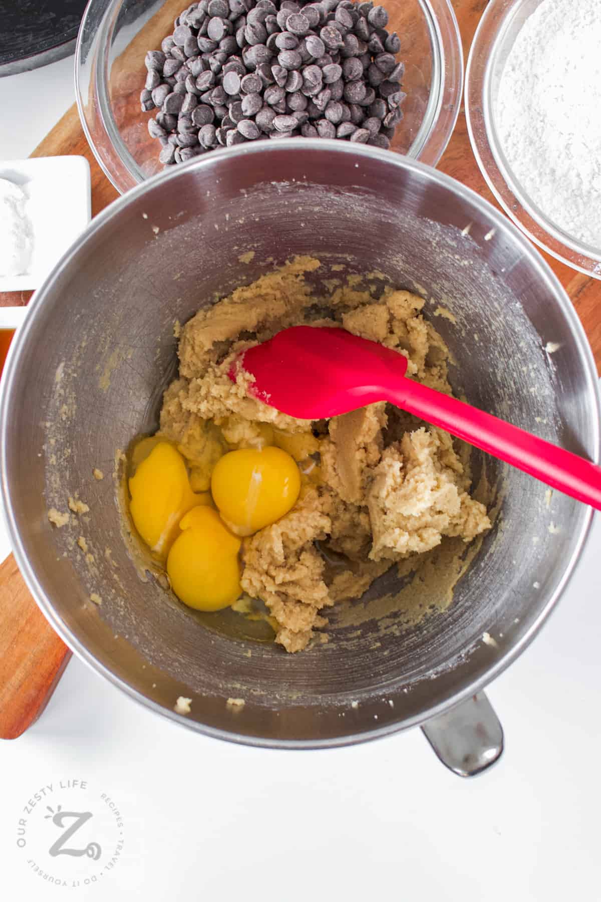 adding eggs to bowl to make Skillet Cookie Recipe