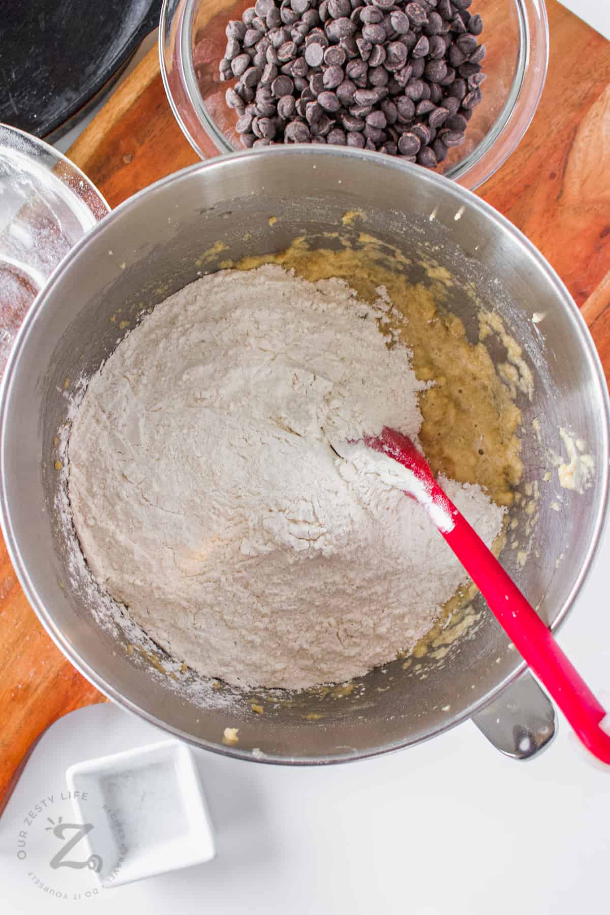 adding flour to bowl to make Skillet Cookie Recipe
