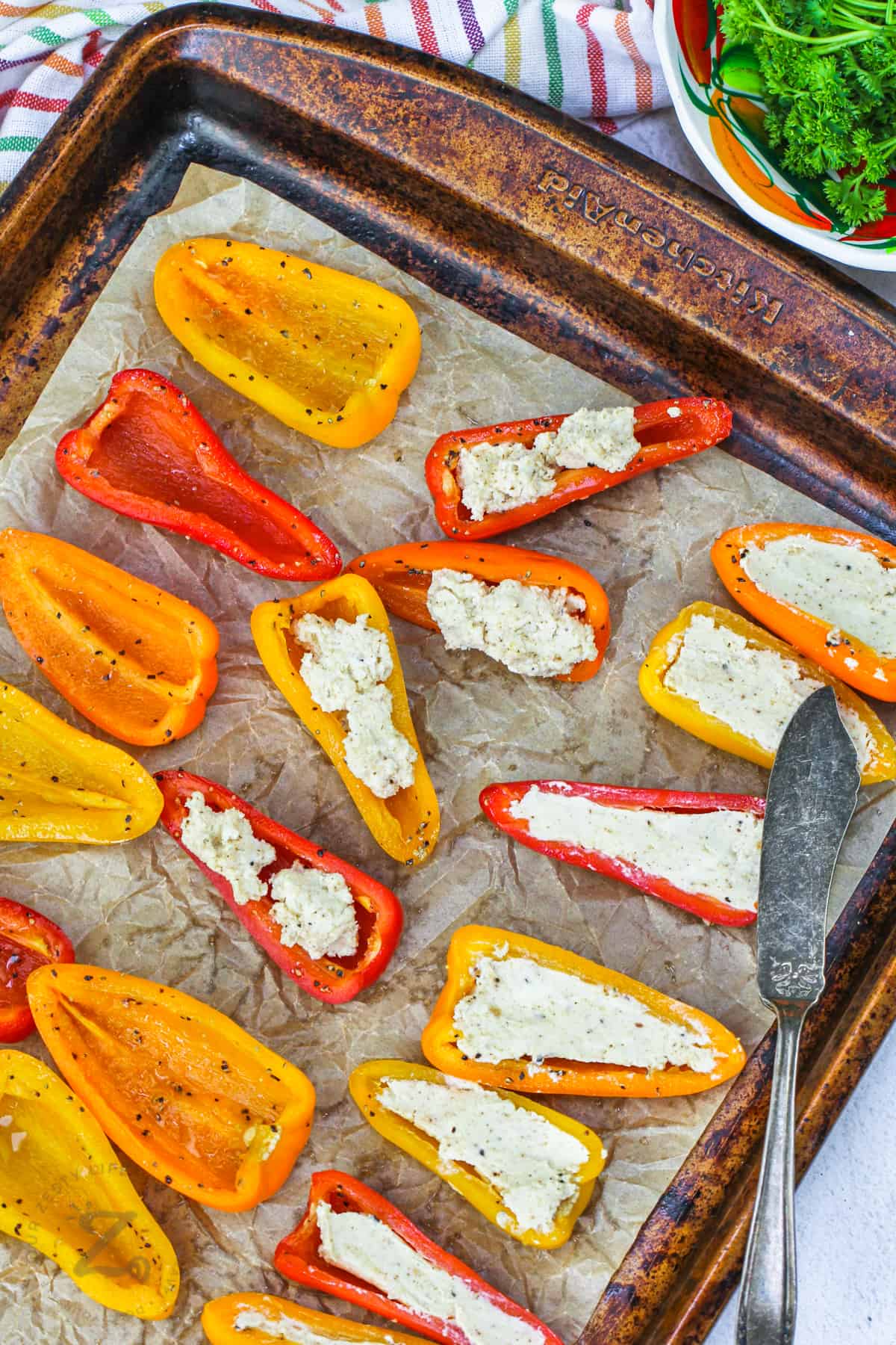 adding filling to peppers to make Stuffed Mini Peppers