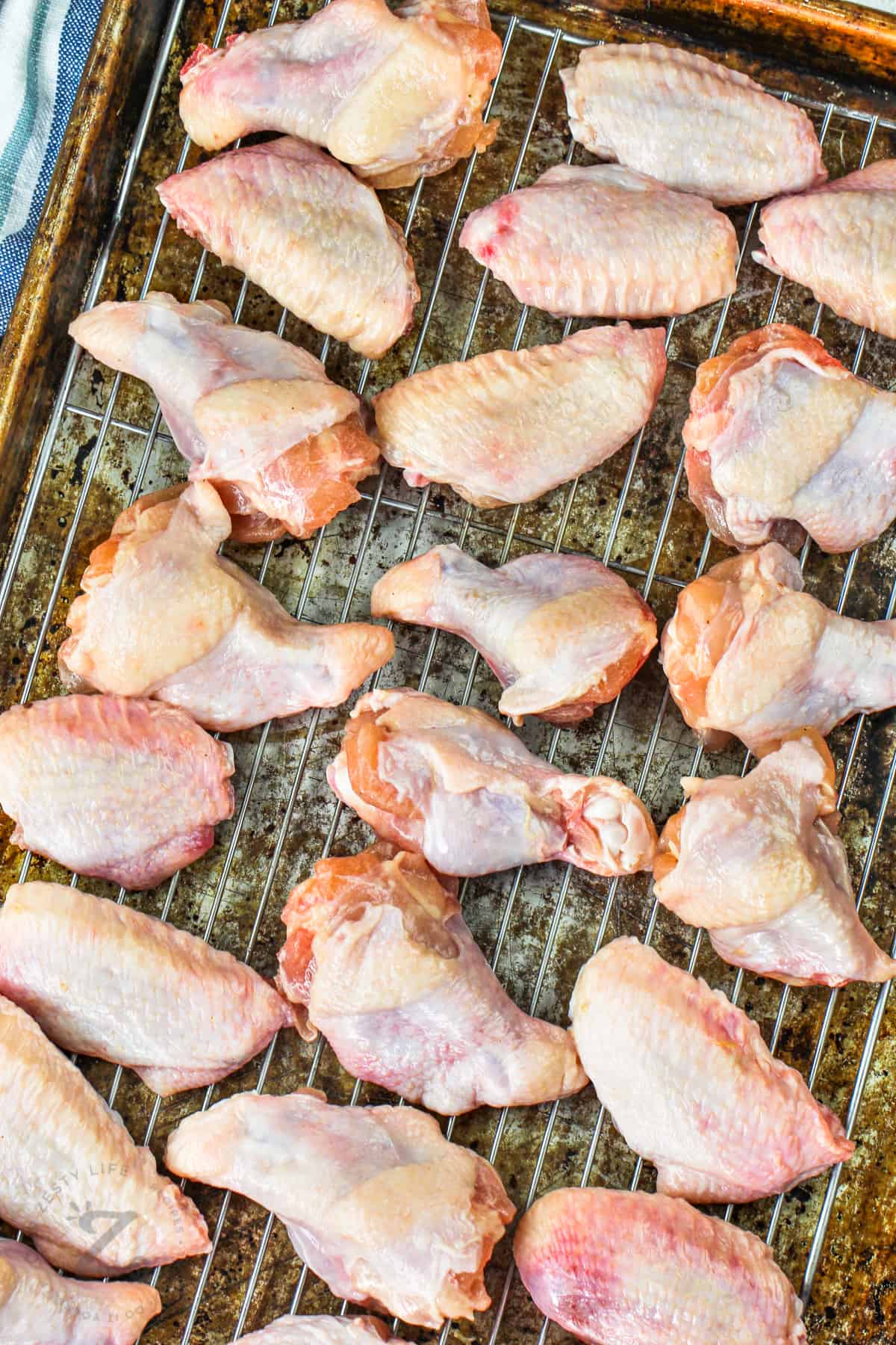 chicken on a sheet pan to make Baked Teriyaki Chicken Wings