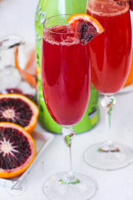 Blood Orange Mimosa with orange slices in the background