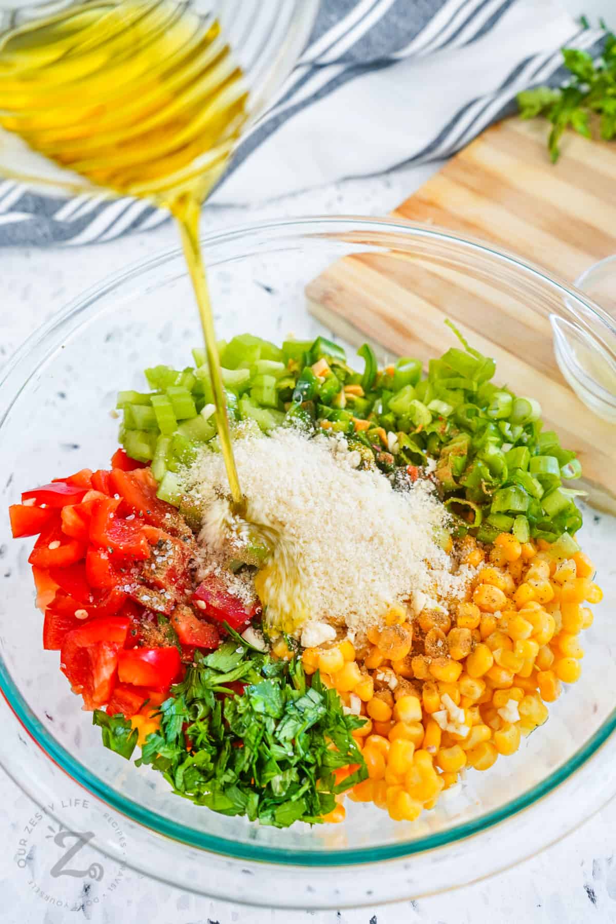 adding dressing to Corn Salad ingredients
