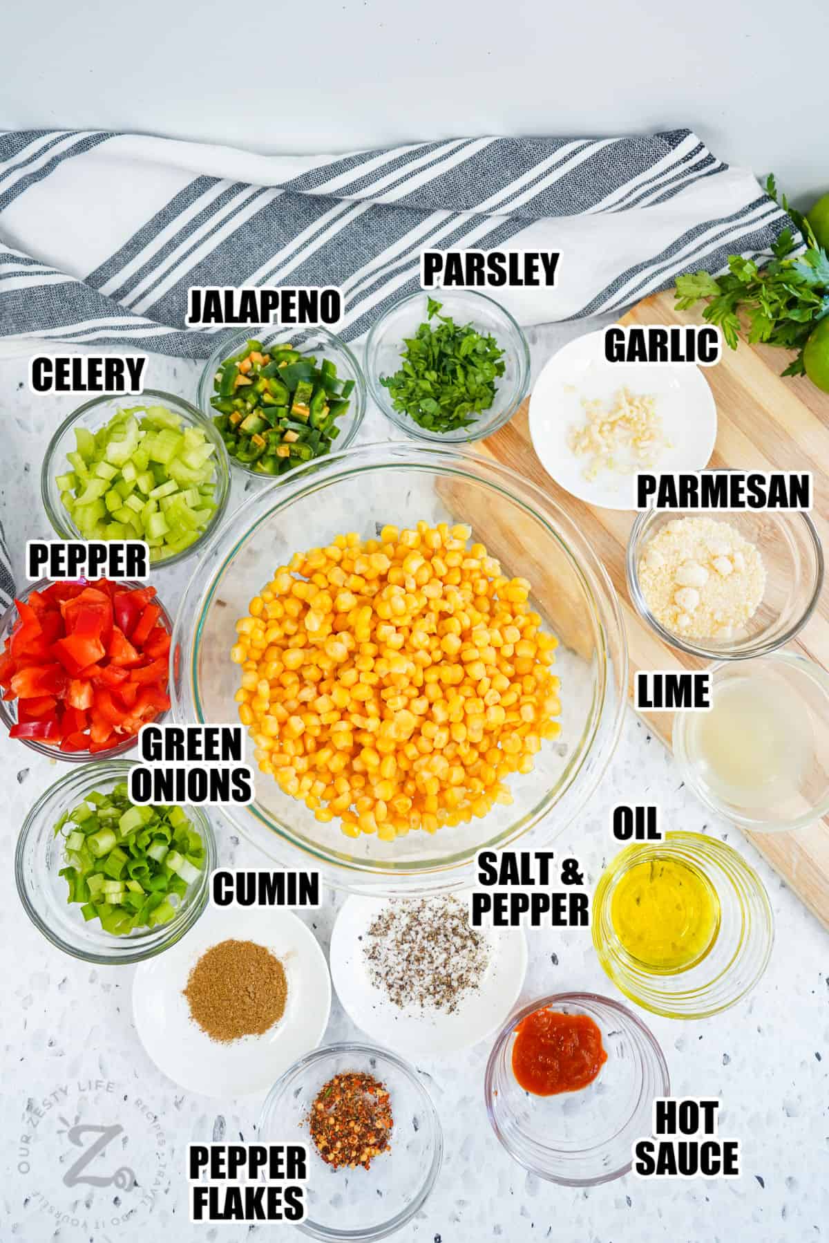 celery , jalapeno , parsley , garlic , parmesan , pepper , lime juice , oil, green onions , cumin , pepper glakes , hot sauce , salt with pepper with labels to make Corn Salad