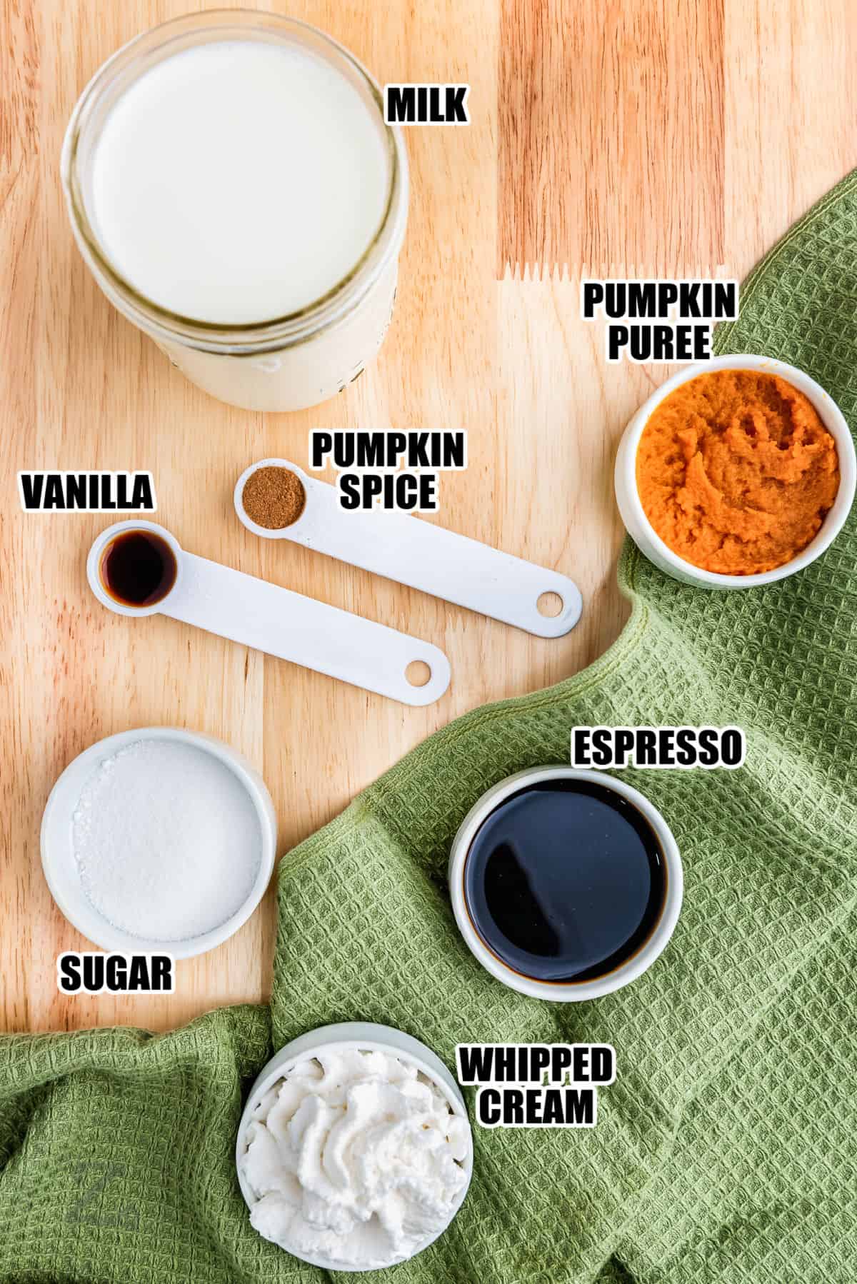 milk , pumpkin puree , pumpkin spice, vanilla , espresso , sugar and whipped cream with labels to make Pumpkin Spice Latte