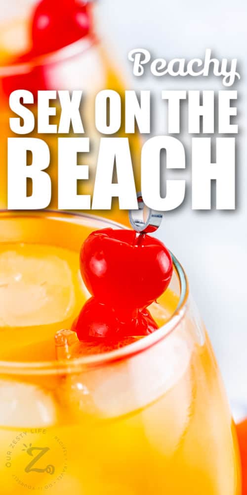cherries in a glass of Sex on the Beach Cocktail with writing