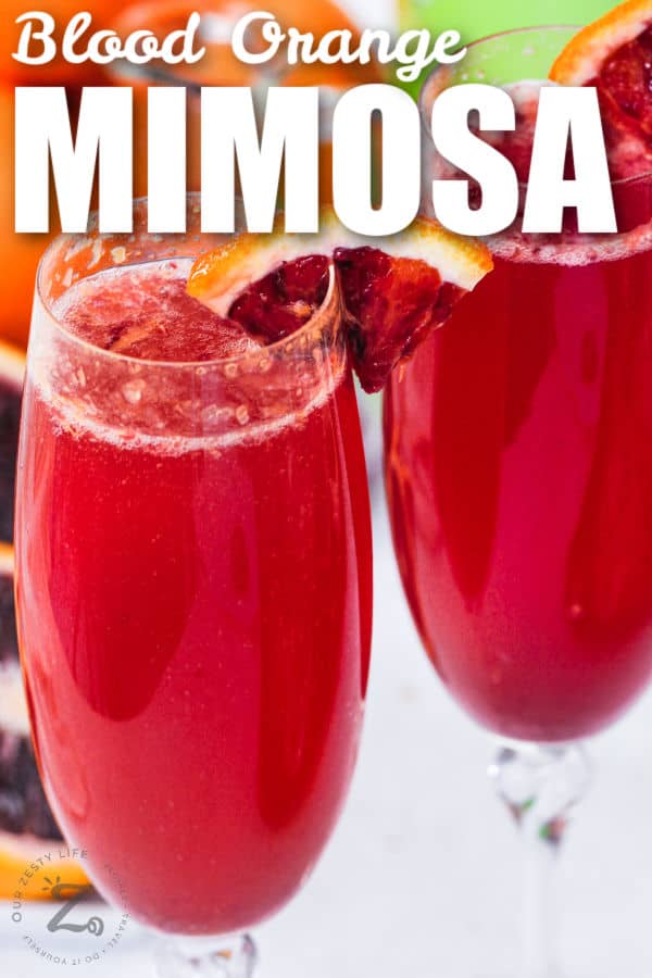 Blood Orange Mimosa with orange slices and a title