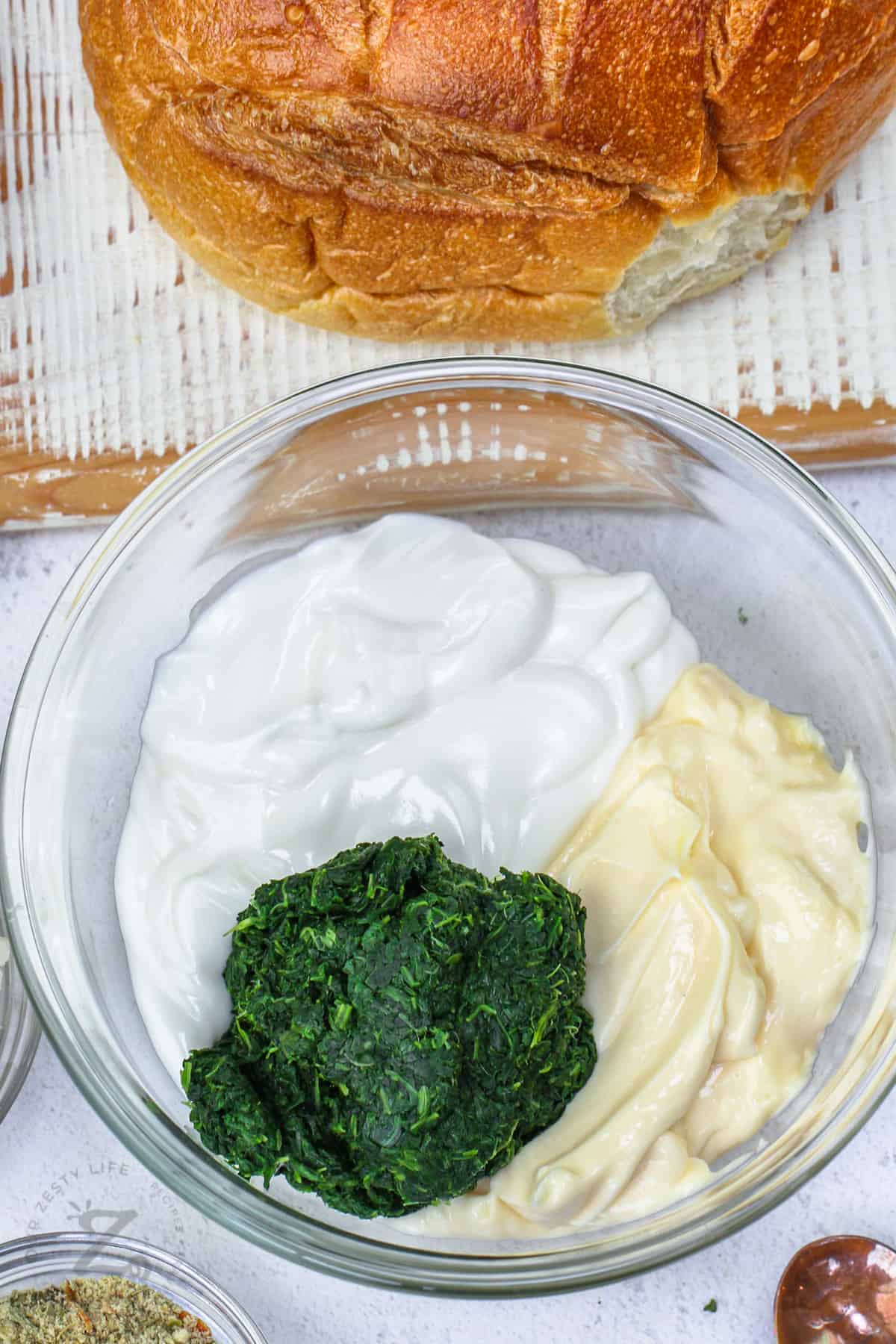 ingredients in a bowl to make Spinach Dip