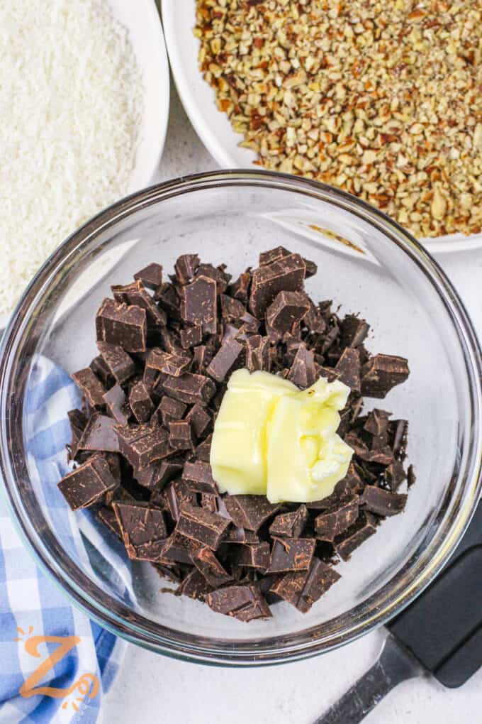 adding butter to chocolate to make Frozen Chocolate Covered Bananas