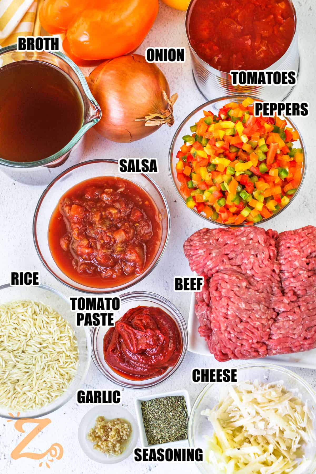 broth , onion , tomatoes , peppers , salsa , rice , beef , romato paste , cheese , seasoning , garlic with labels to make Stuffed Pepper Casserole