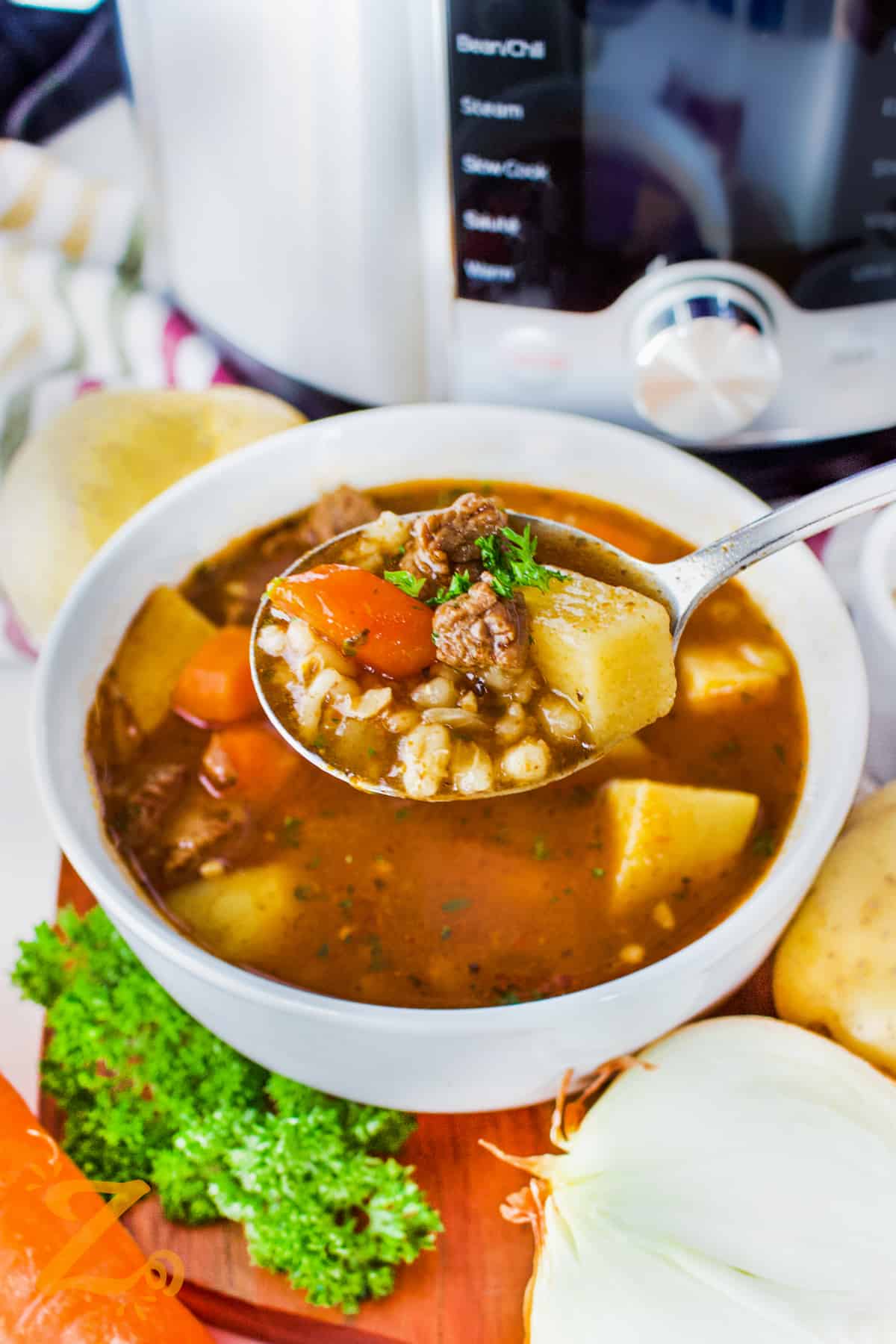 Instant Pot Beef Barley Soup on a spoon