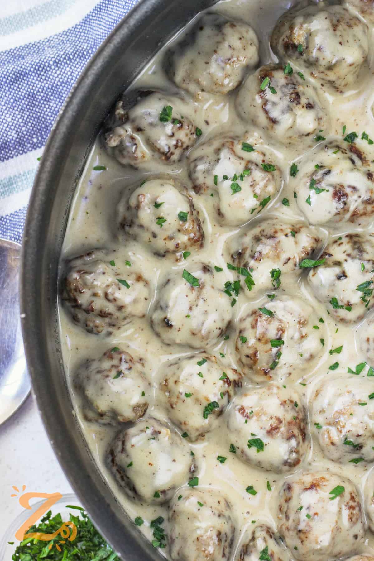 close up of cooked Swedish Meatballs in a pan