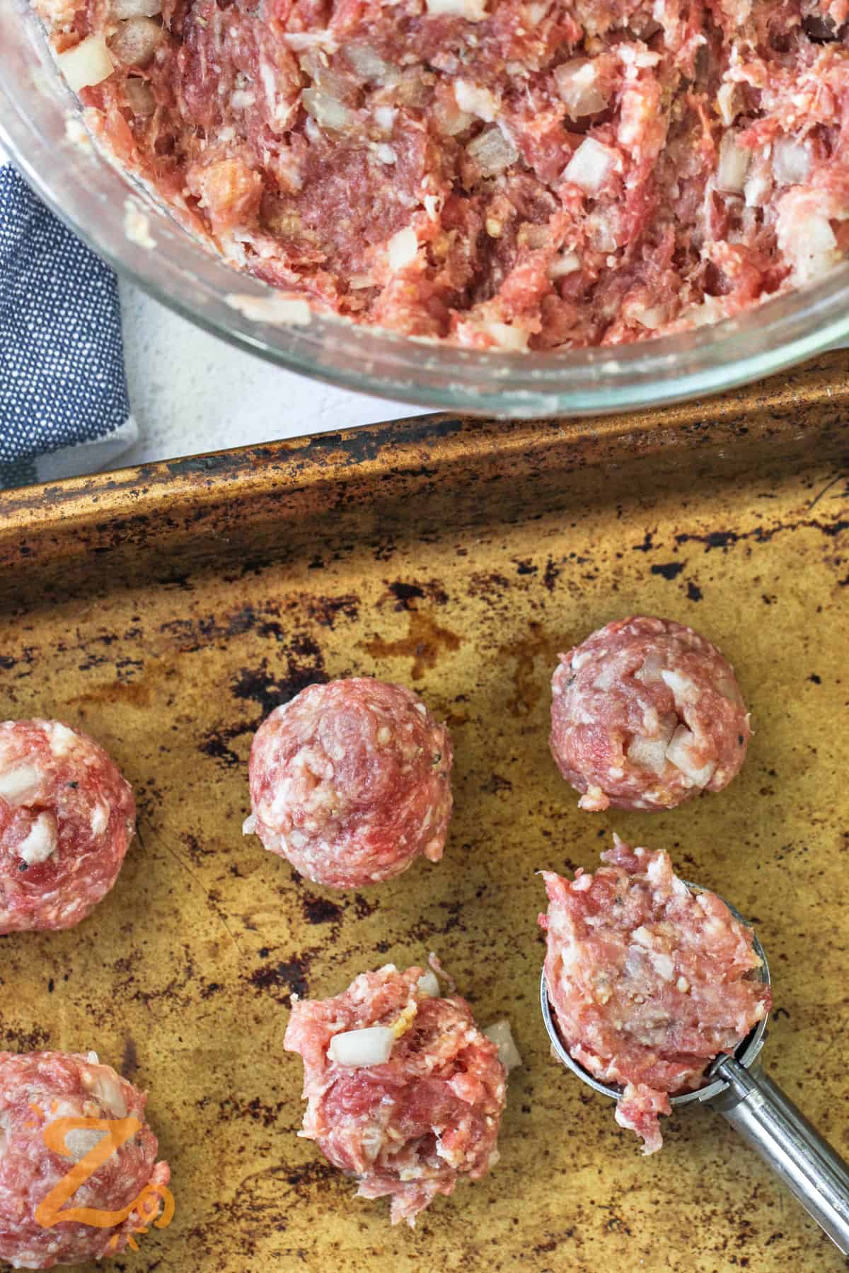 shaping Swedish Meatballs into balls before cooking