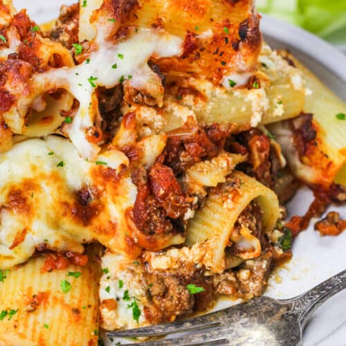 Baked Rigatoni on a plate with salad