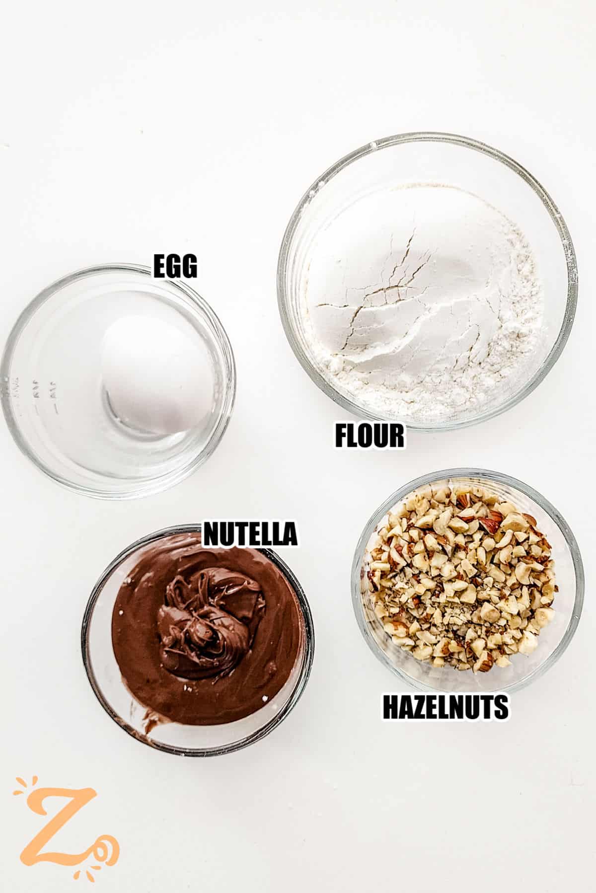 egg , flour, Nutella, hazelnuts with labels to make Nutella Cookies