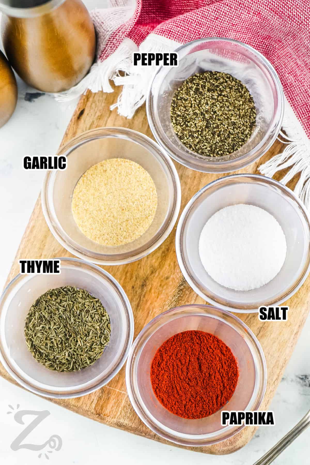 garlic , pepper , salt , thyme , and paprika with labels to make Steak Seasoning