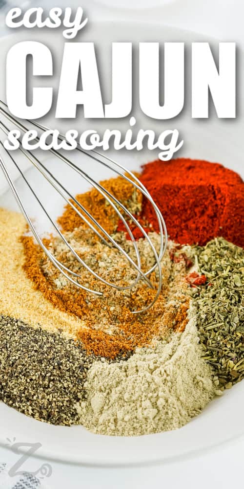 mixing spices to make Cajun Seasoning with writing